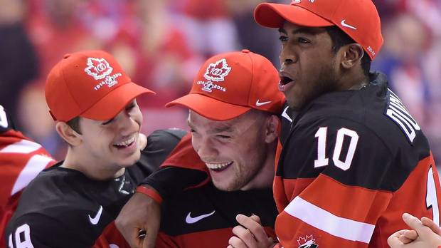 Canada’s Max Domi, centre, celebrates with teammates Nic Petan, left, and Anthony Duclair after being named best forward of the 2015 IIHF World Junior Hockey Championship in Toronto on Jan. 5. (Frank Gunn/THE CANADIAN PRESS)