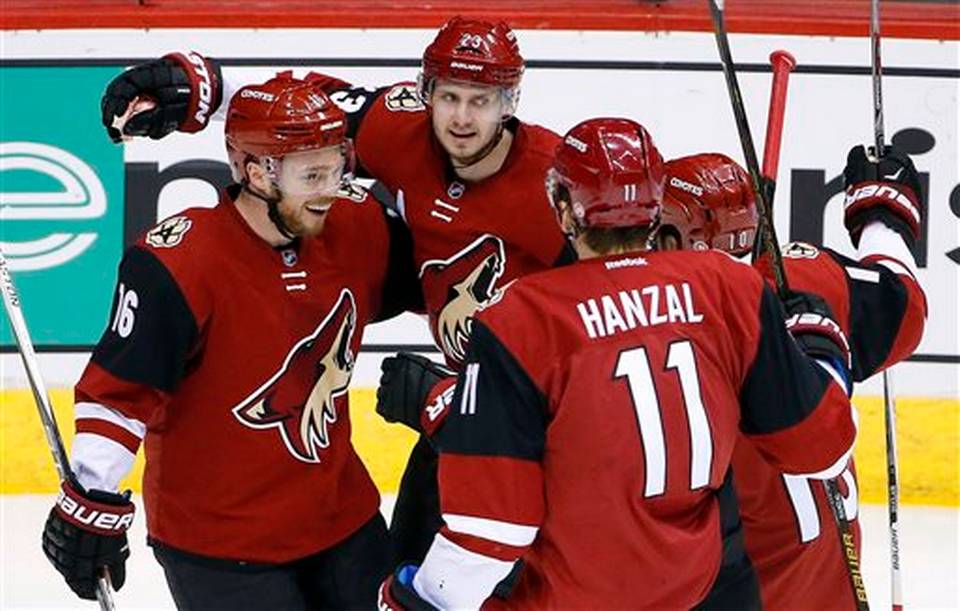 Arizona Coyotes' Oliver Ekman-Larsson (23), of Sweden, celebrates his goal against the Los Angeles Kings with Max Domi (16), Martin Hanzal (11), of the Czech Republic, and Anthony Duclair (10) during the second period of an NHL hockey game Saturday, Jan. 23, 2016, in Glendale, Ariz. Ross D. Franklin AP Photo